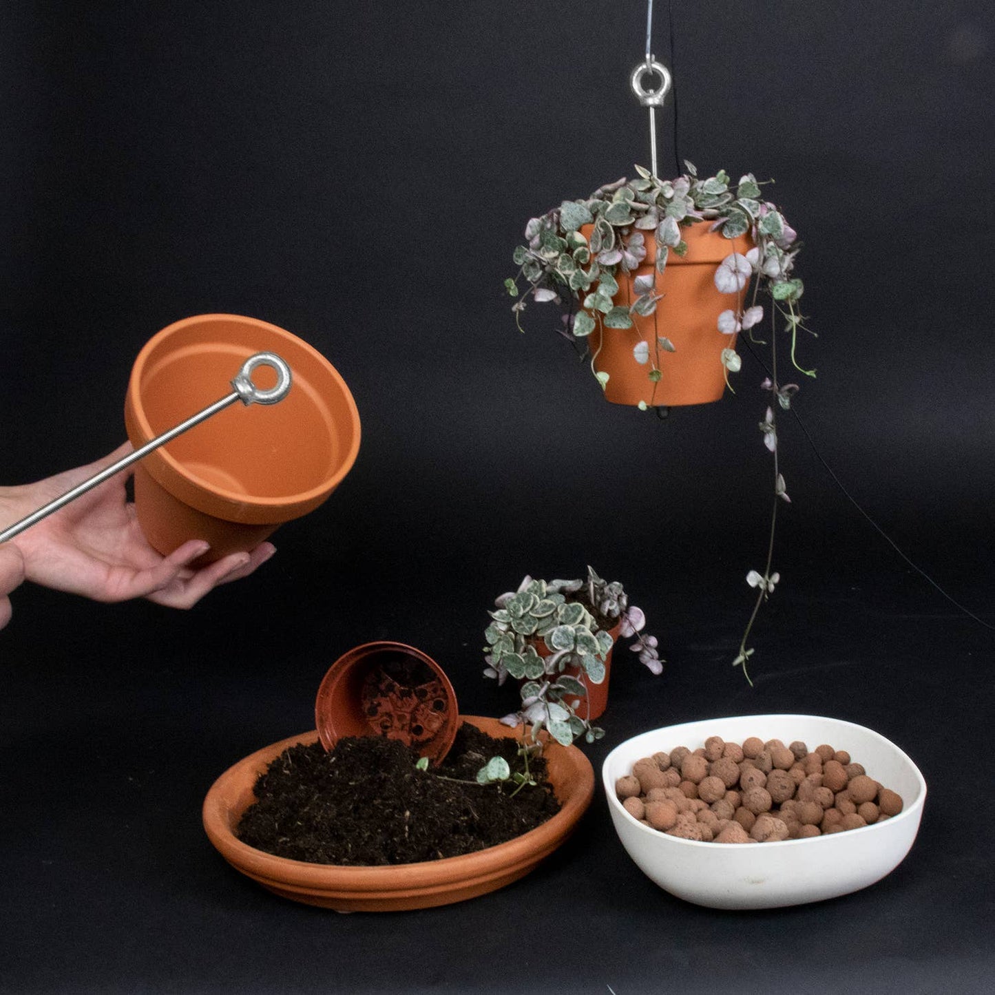 Hanging planter system for plant pots