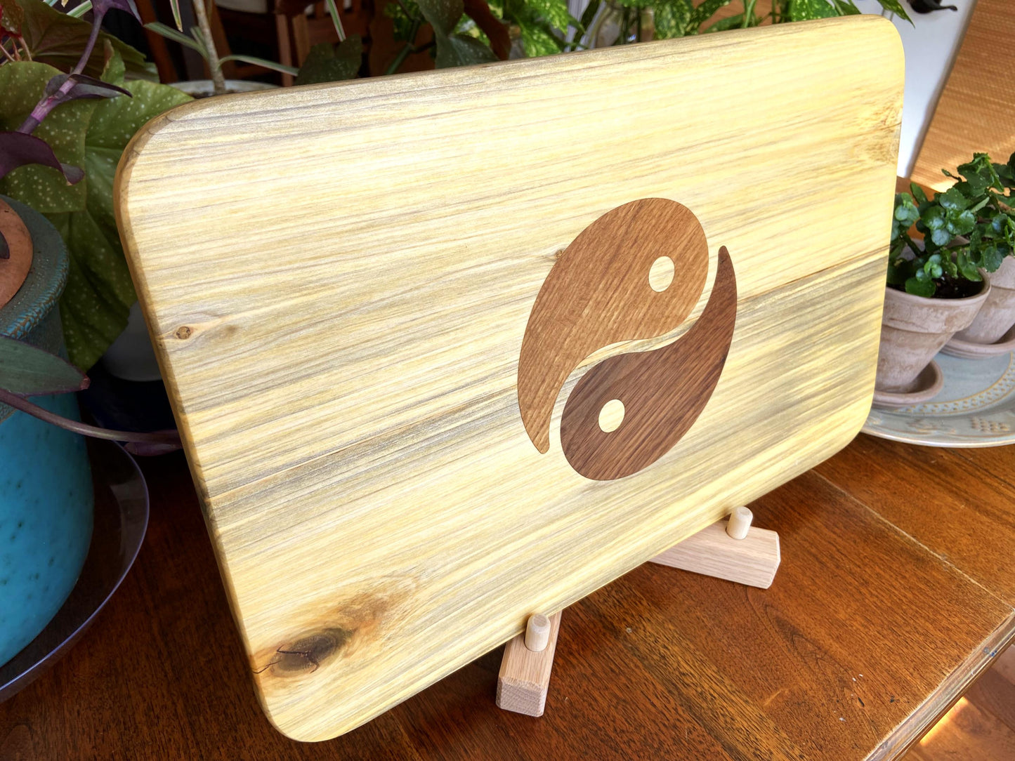 Poplar charcuterie board with Yin Yang inlay made from White Oak and Peruvian Walnut.