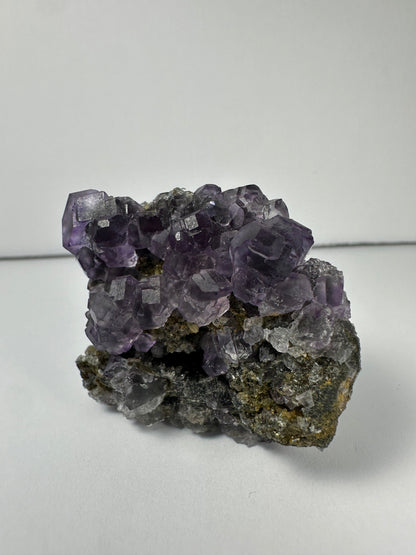 Purple Dodecahedral Fluorite with Calcite on matrix
