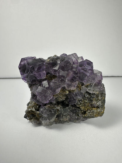 Purple Dodecahedral Fluorite with Calcite on matrix