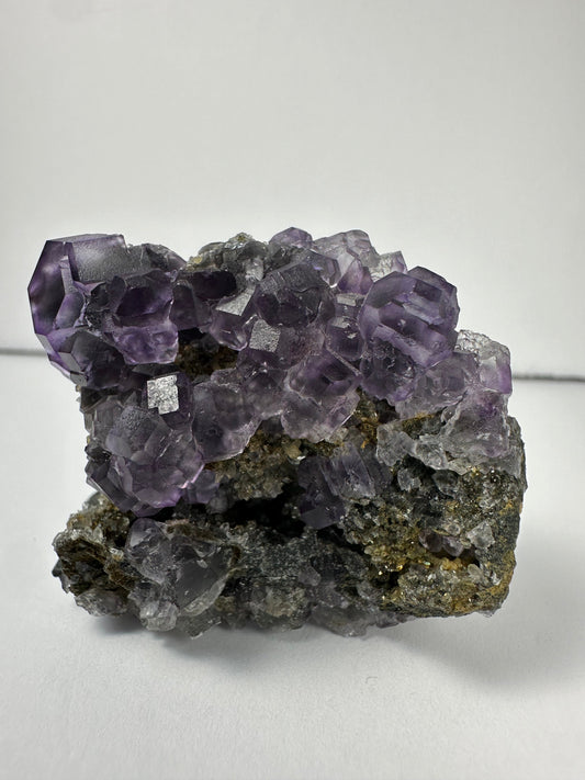 Purple Dodecahedral Fluorite with Calcite on matrix