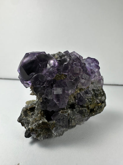 Purple Dodecahedral Fluorite with Calcite on matrix
