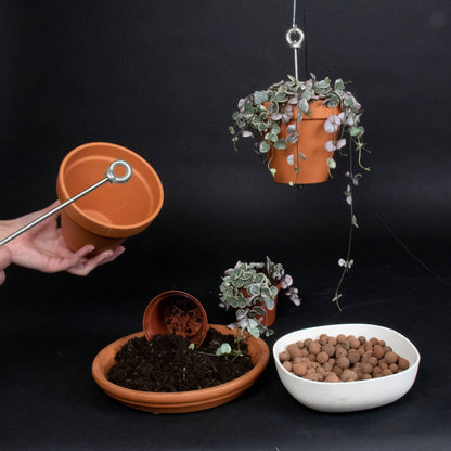 Hanging planter system for plant pots