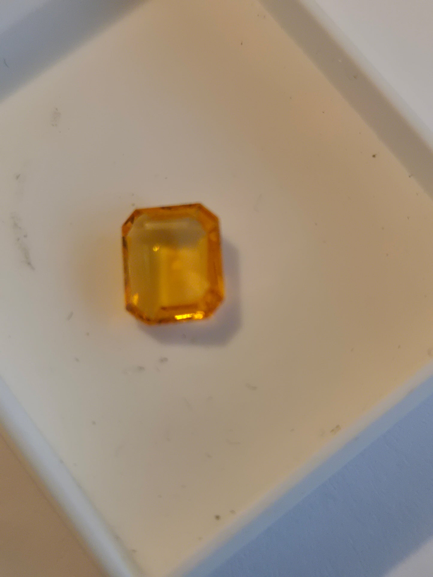 Spessartine garnet emerald cut facet