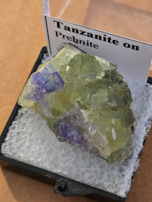 Tanzanite on green prehnite specimen