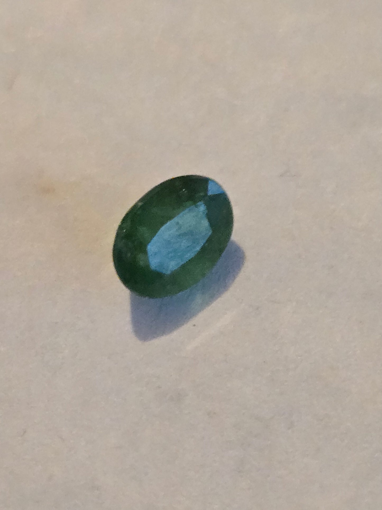 Tsavorite garnet facet