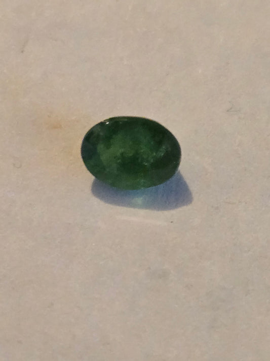 Tsavorite garnet facet